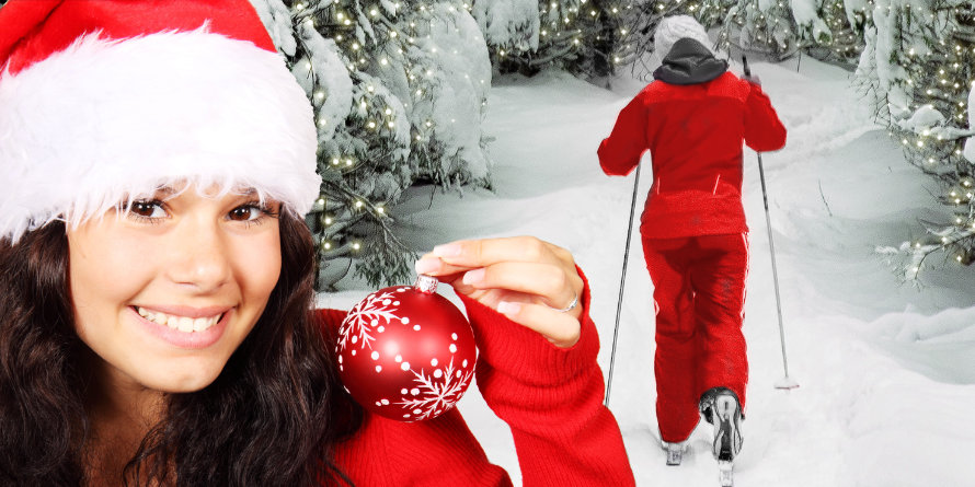 Symbolbild zu Weihnachten und Winterzeit: Frau im eingepinkelten Ski-Anzug in Weihnachtlicher Winterlandschaft.